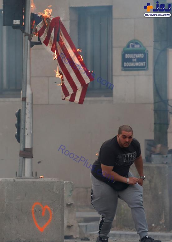 آتش زدن پرچم برافراشته آمریکا +عکس