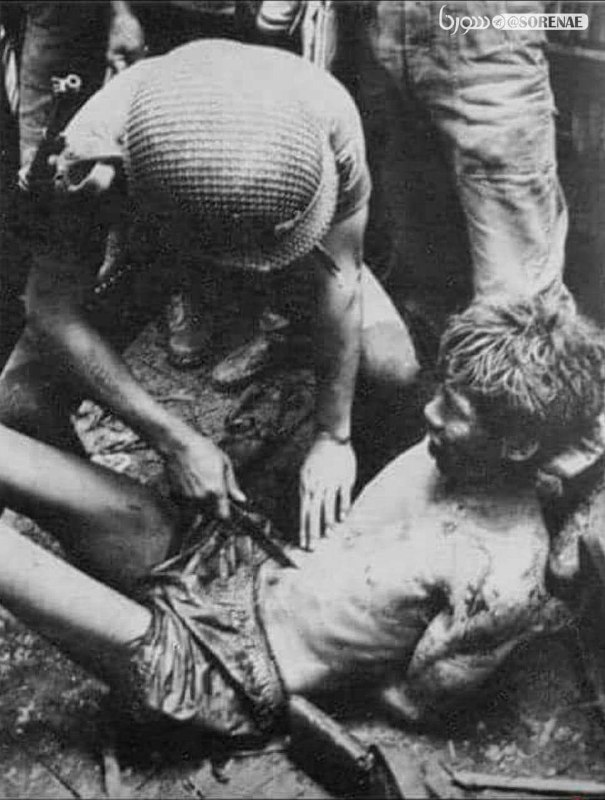 شکنجه عجیب اسیر ویتنامی توسط سرباز آمریکایی + عکس