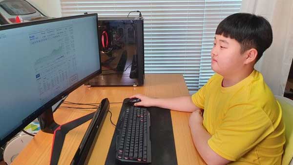 پسر ۱۲ساله کره‌ای از بورس میلیونر شد+عکس