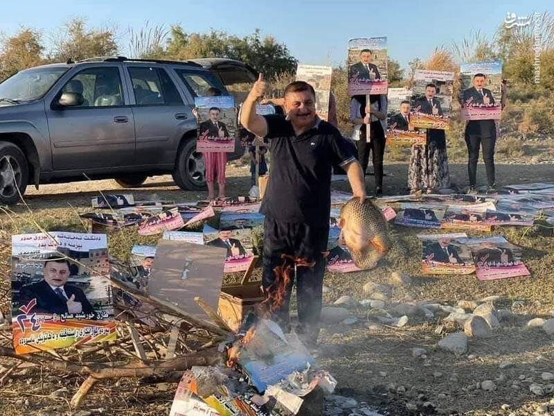 کاندیدای شکست‌خورده عراق پوسترها را کباب کرد + عکس
